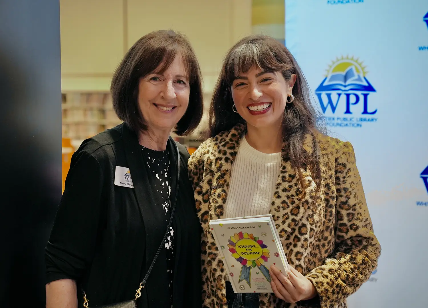 Author with guest holding book