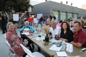 Community celebrating Booktoberfest outdoors