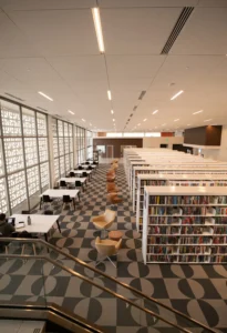Spacious modern library with bookshelves and seating